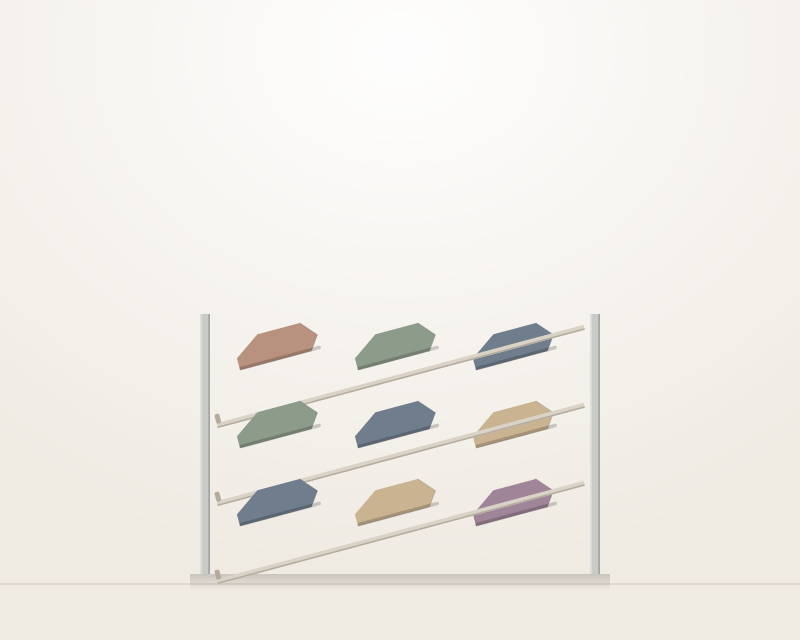 Two angled shoe shelves mounted in a wardrobe bay, each holding three pairs of shoes tilted toe-outward behind a slim retaining lip